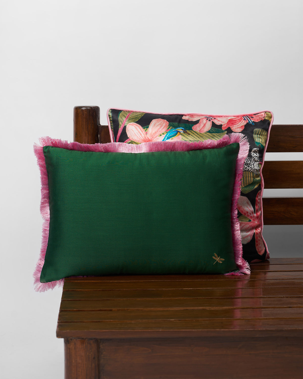 Kinaara Cushion Cover in green with pink fringe and a small gold dragonfly.
