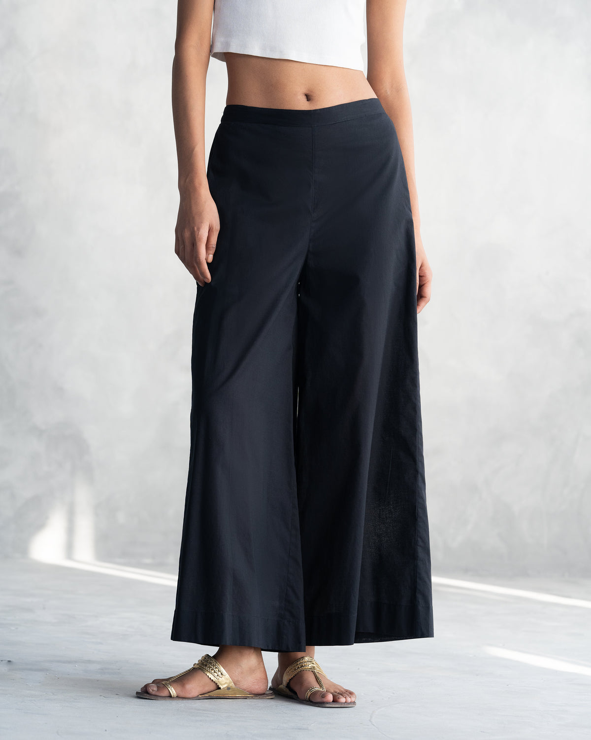Close-up of the black wide-leg pants from the Eclipse set.