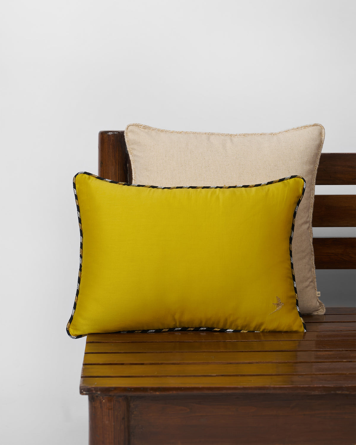 Midas cushion cover in yellow with a piped edge.