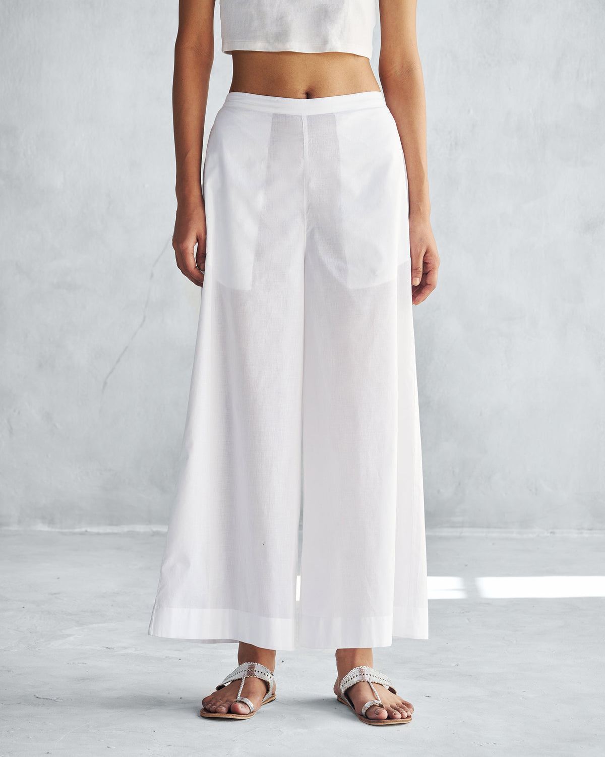 Person wearing white Basic Pyjamas with front pockets.