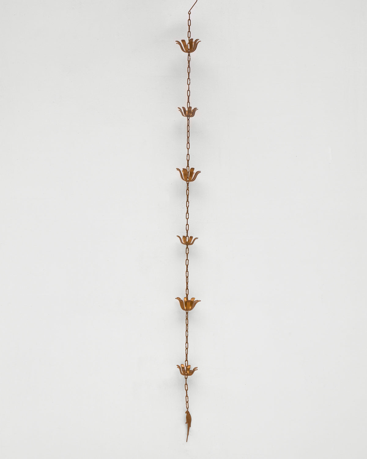Full length of the Madagascar Rain Chain with flower-shaped cups.