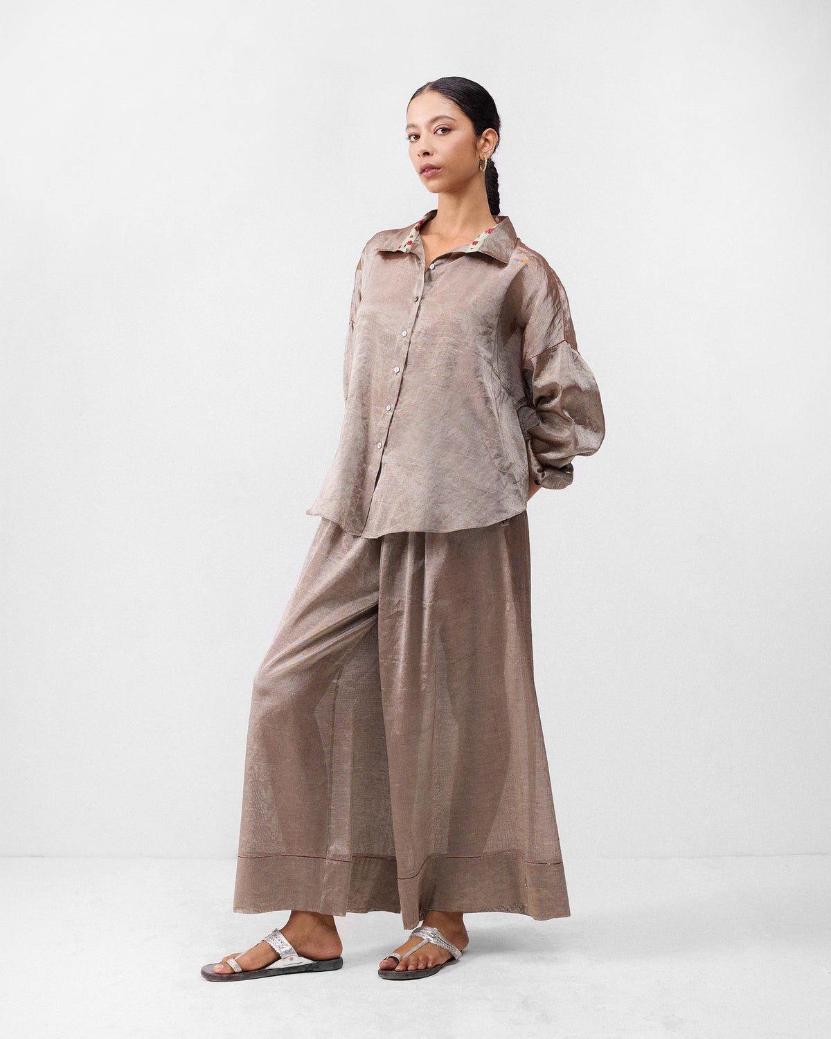 Full-length view of a silver Firefly Shirt worn by a person.