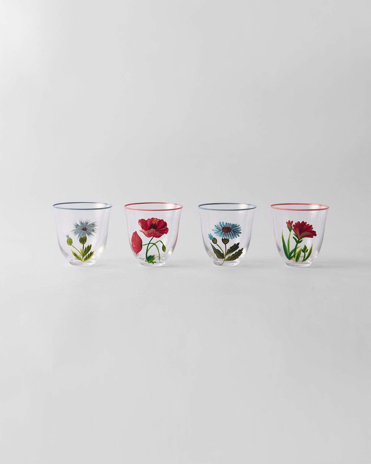 Set of four Rit tumblers with hand-painted daisy, poppy, cornflower, and carnation motifs.