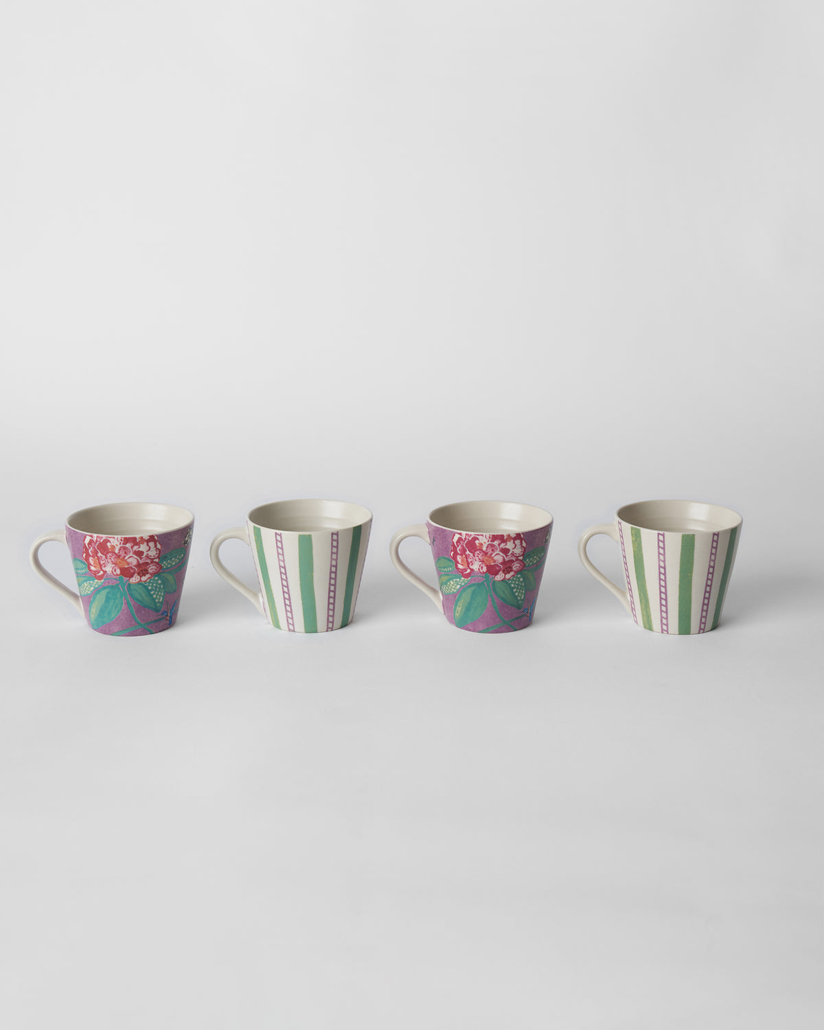 Set of four Buransh Espresso Mugs alternating purple blooms and green stripes.
