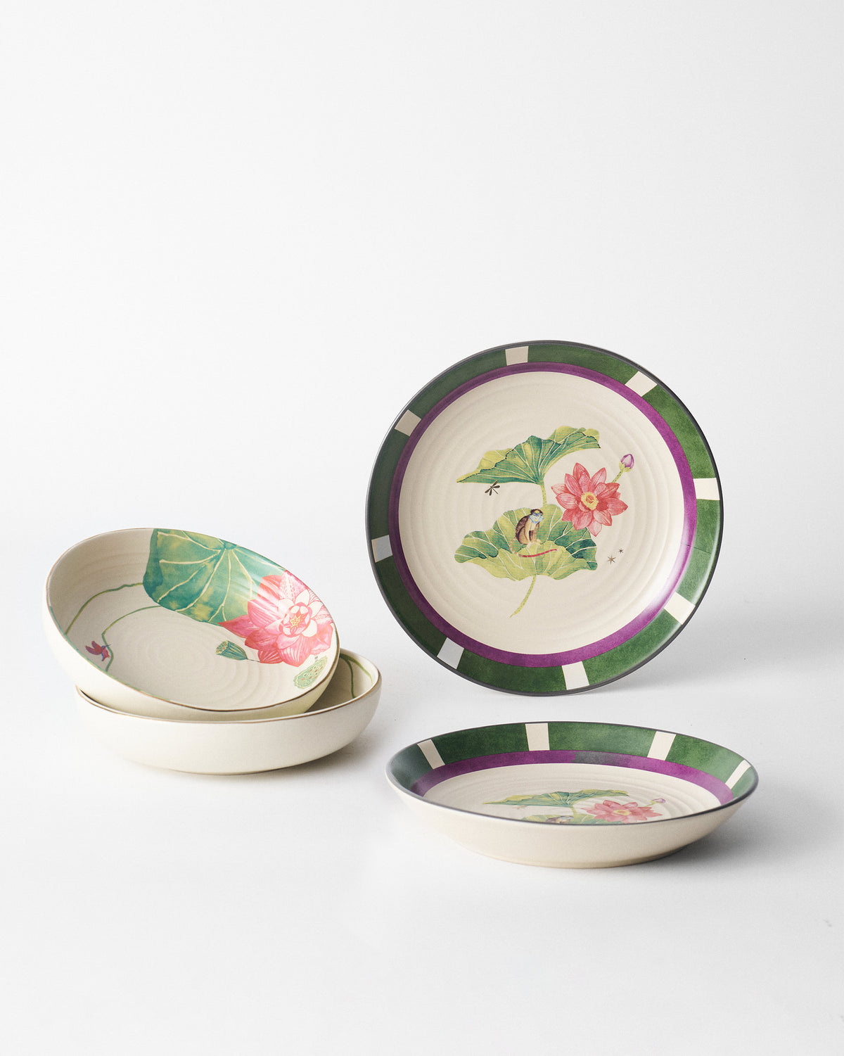 Lotus Garden pasta plates and bowls arranged with matching lotus motifs.