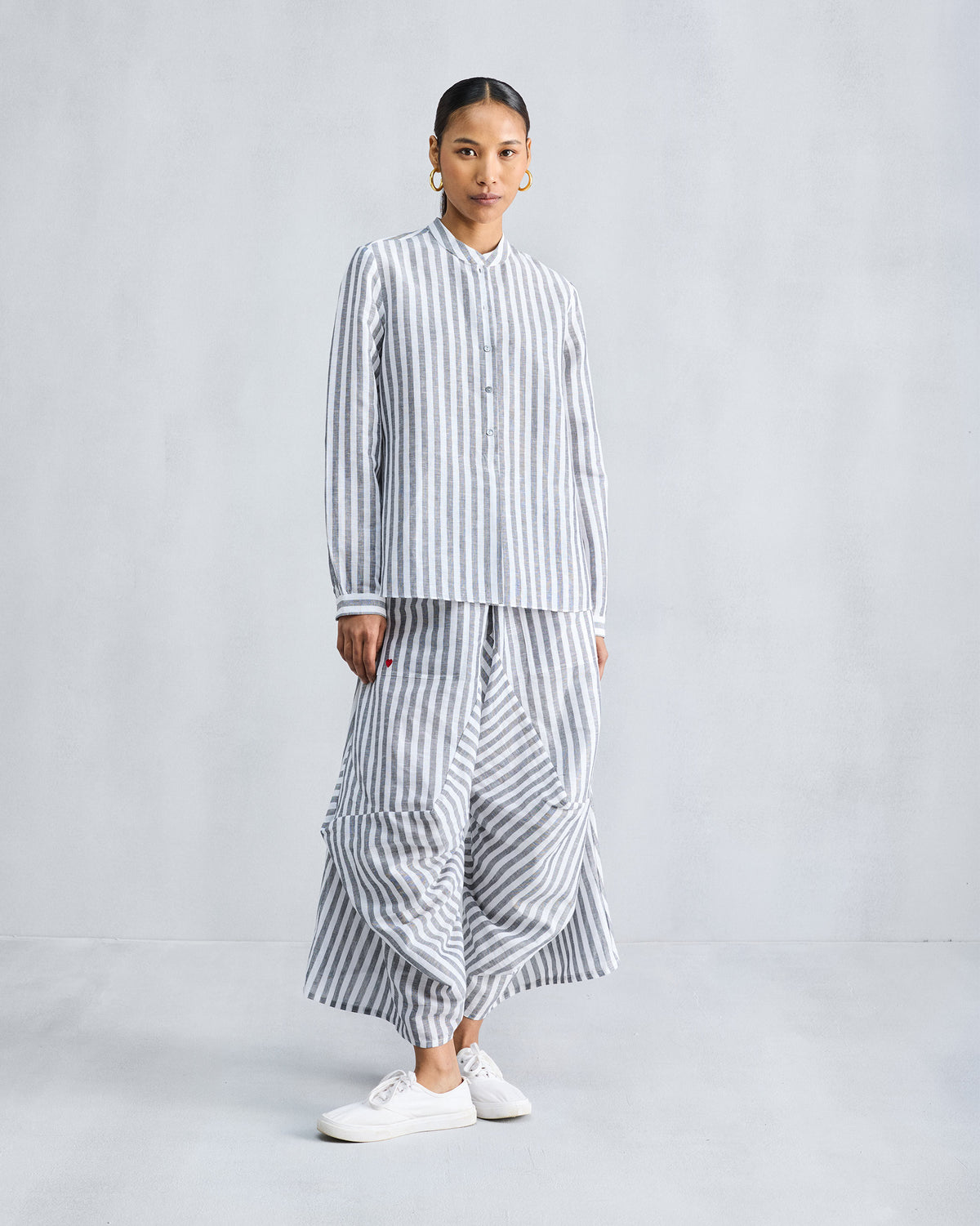 Person wearing the Mandarin Collar Set in charcoal and white stripes with a band collar.