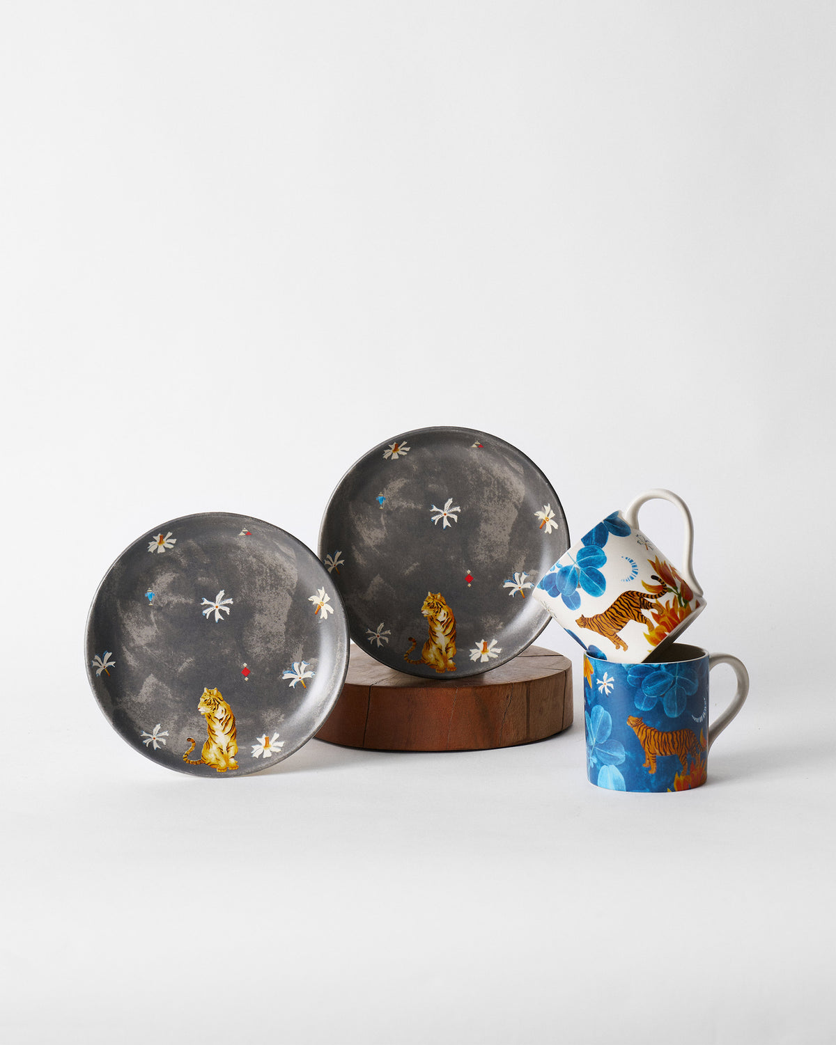 Nadi morning set with two charcoal tiger plates and two tiger-print mugs.