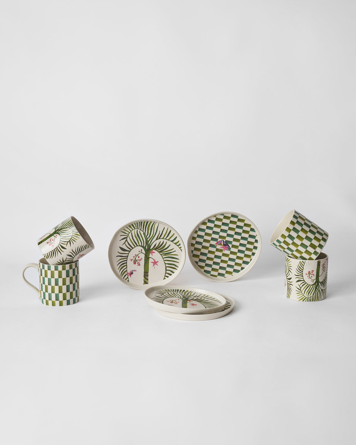 Hornbill gift set showing palm and green check mugs with matching small plates.