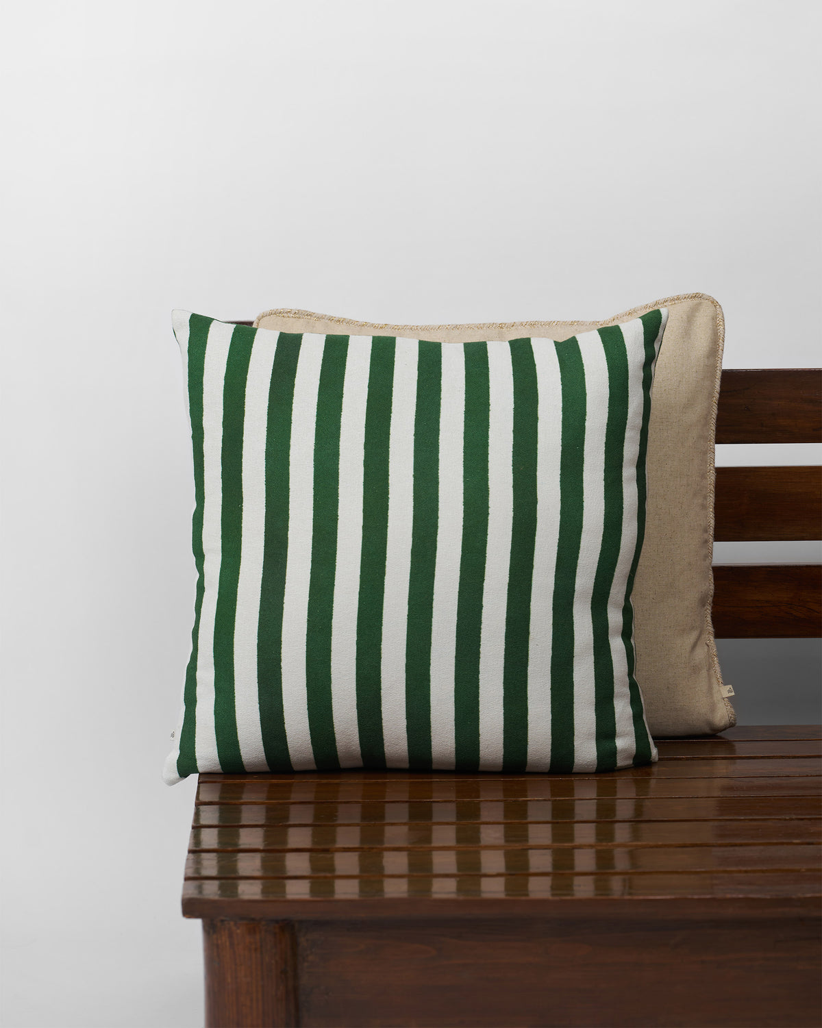 Buransh Bloom Cushion Cover in green and white vertical stripes.