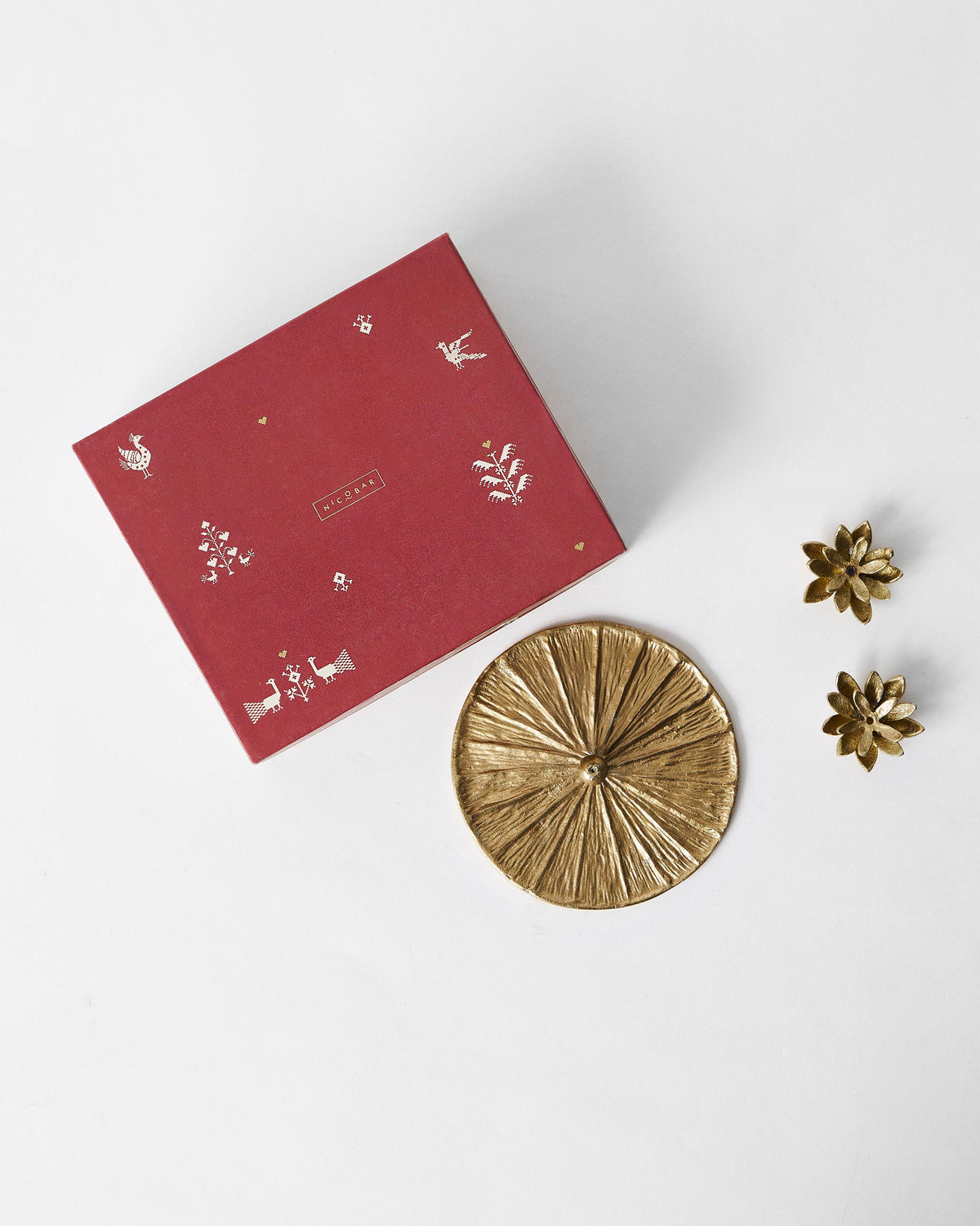 Garden Essence gift box laid flat with brass incense tray and lotus holders.