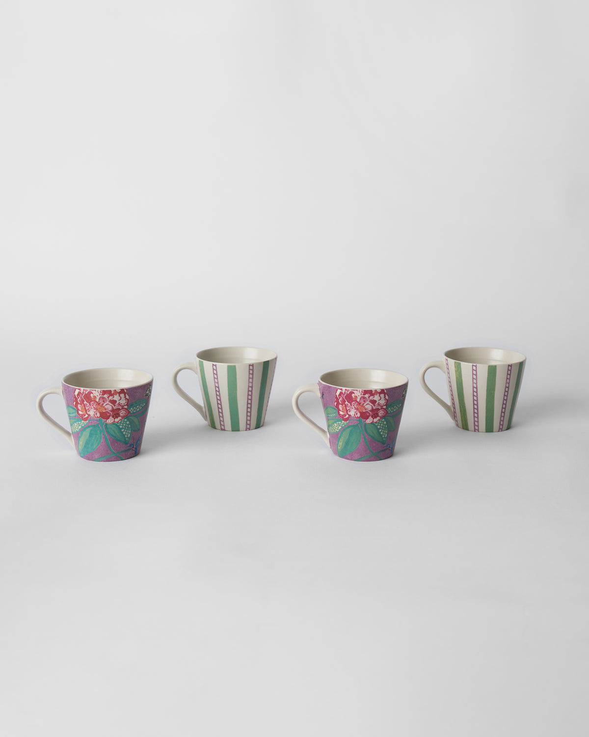 Four Buransh Espresso Mugs in purple floral and green stripe designs.
