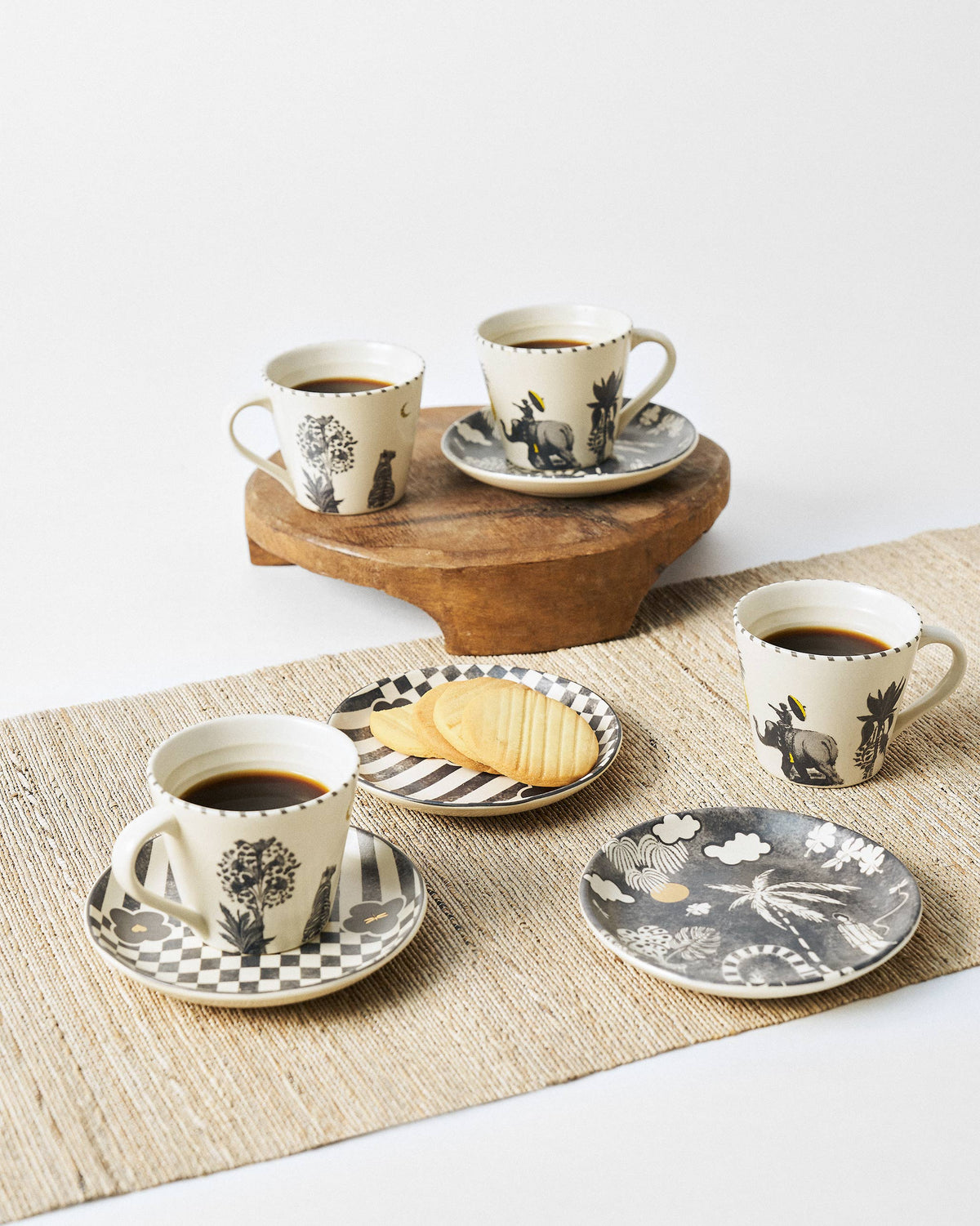 Mandovi Morning Set with coffee-filled mugs and patterned tea plates.
