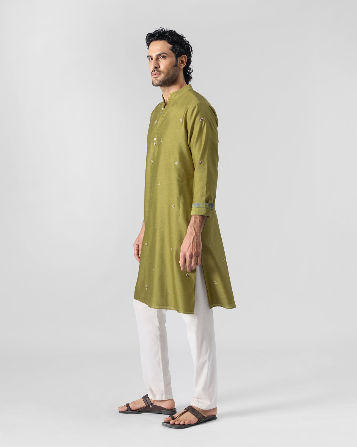 Side view of an olive Rey kurta with a band collar, worn by a person.