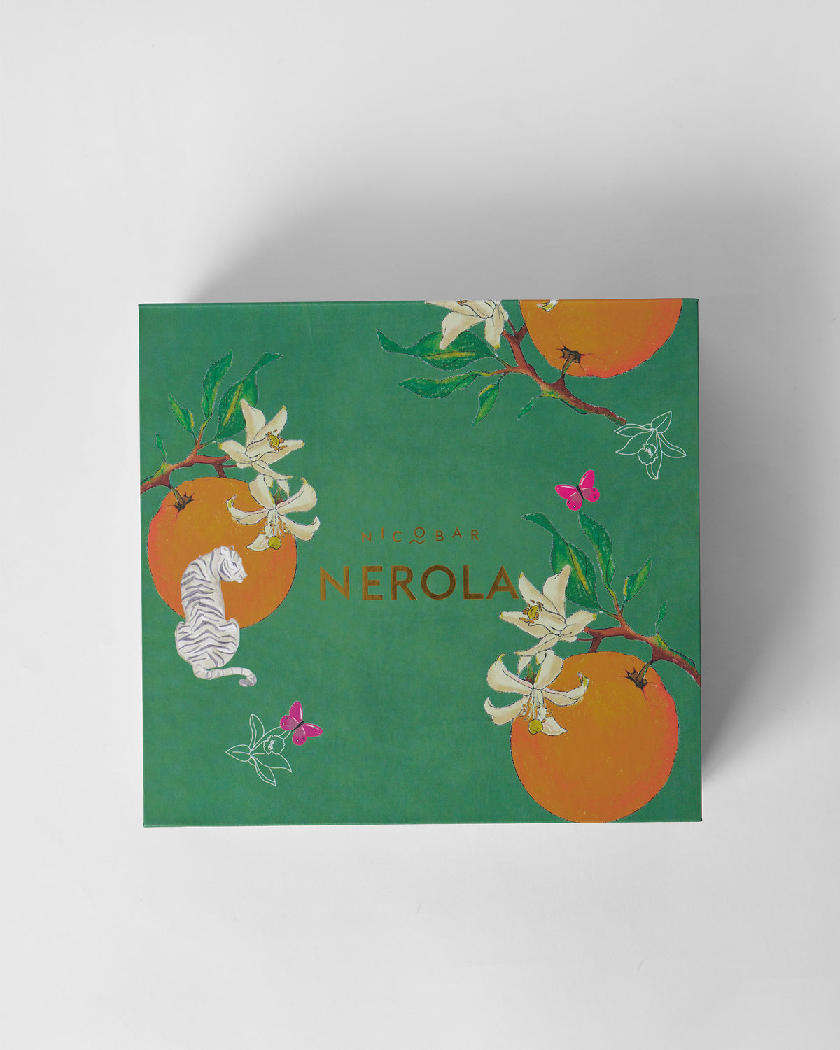 Green Nerola gift box lid with oranges, blossoms, and a white tiger.