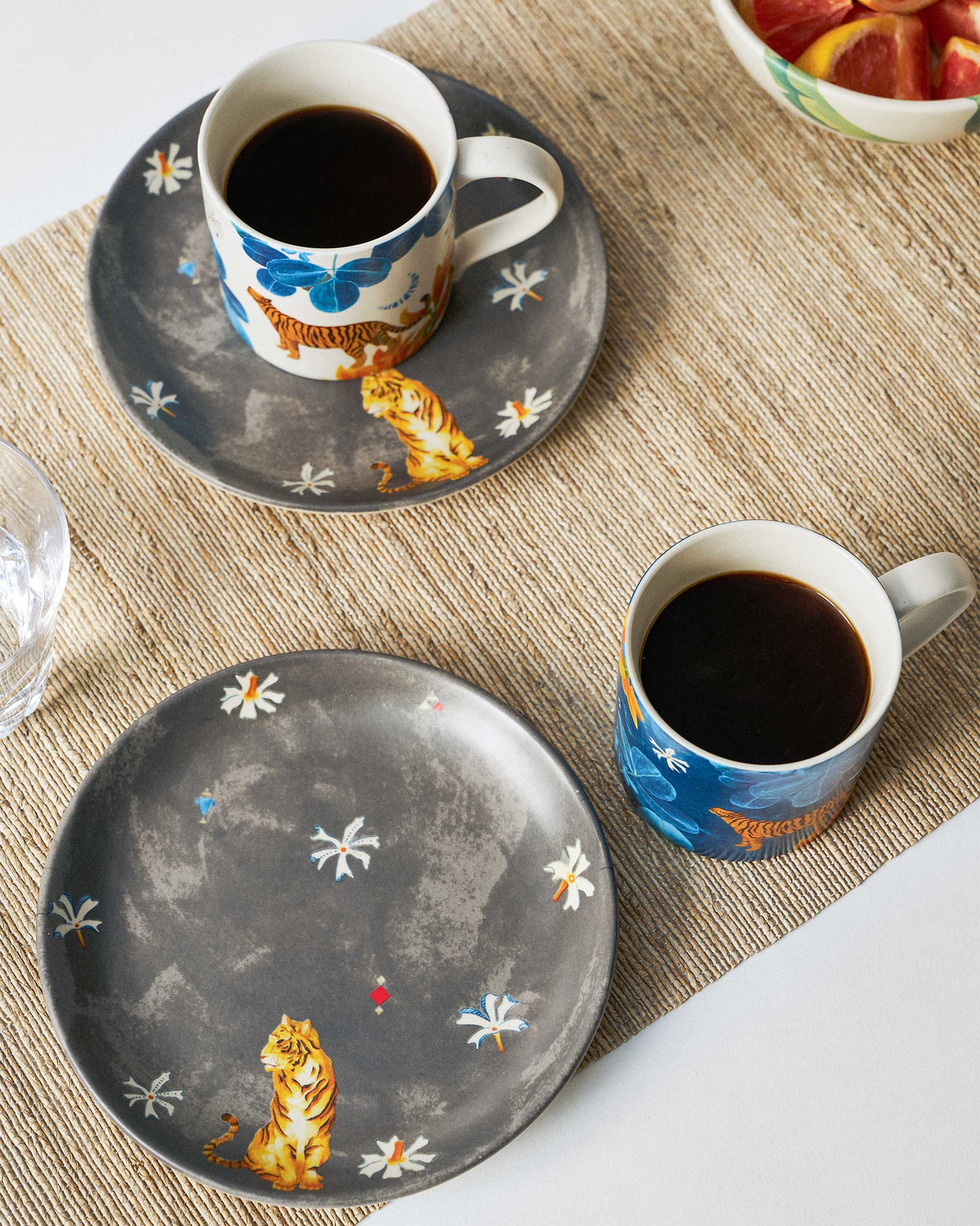 Nadi morning set of tiger-print mugs and charcoal plates set for breakfast.