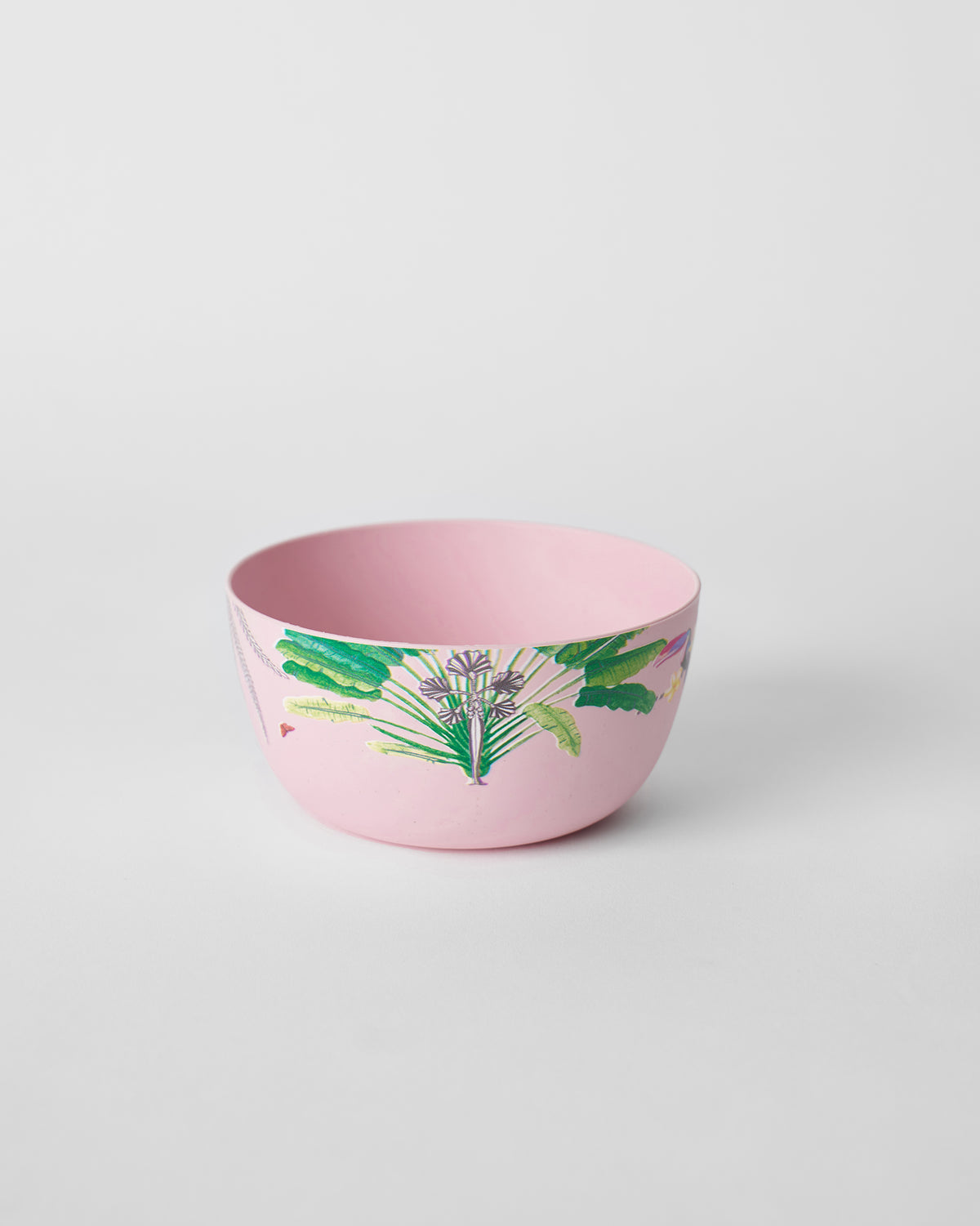 Pink Toucan bamboo cereal bowl showing its open interior and green tropical leaf print.