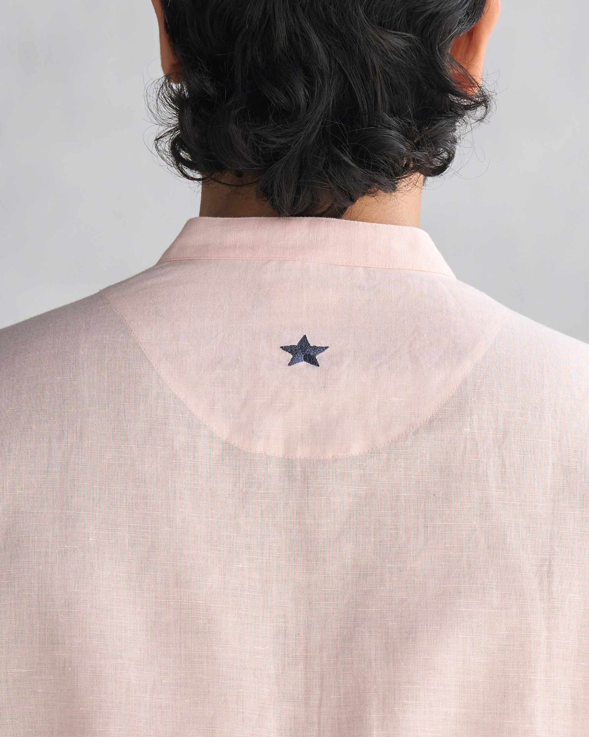 Close-up of the embroidered star on a pink Chandni Chowk kurta.