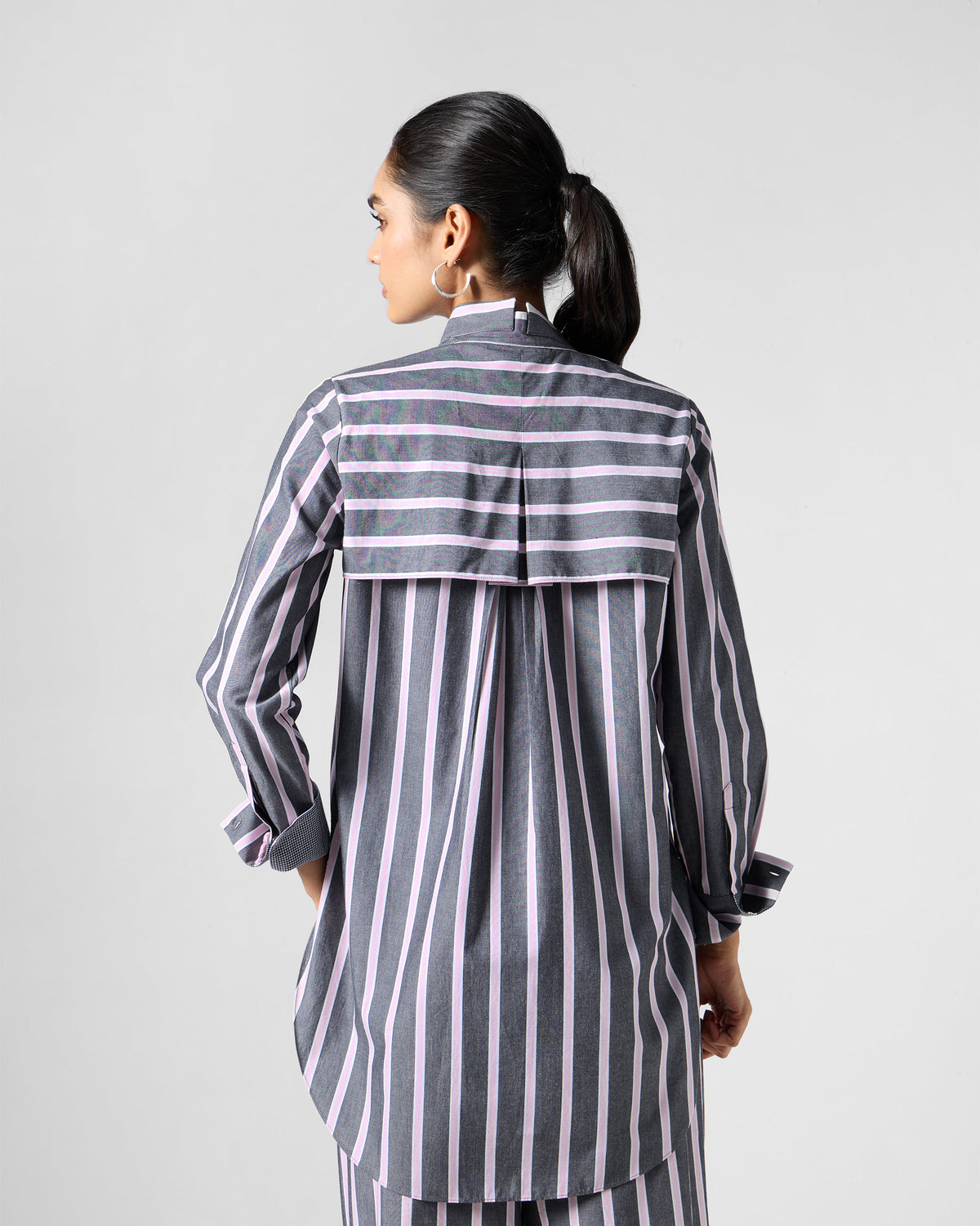 Back of a charcoal and pink striped Trench shirt with a horizontal yoke.