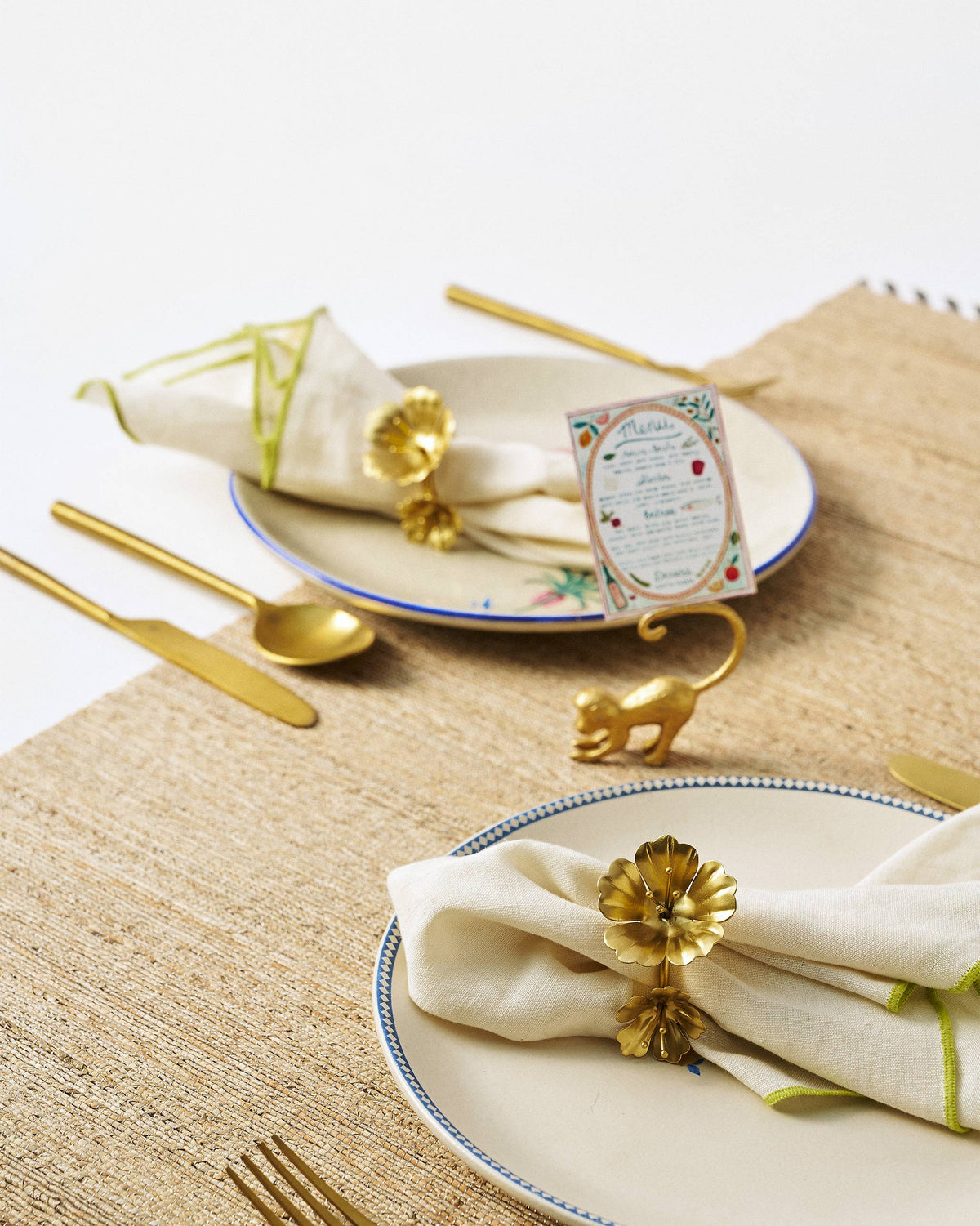 Jungle Table Set with gold floral napkin rings and a monkey menu card holder.