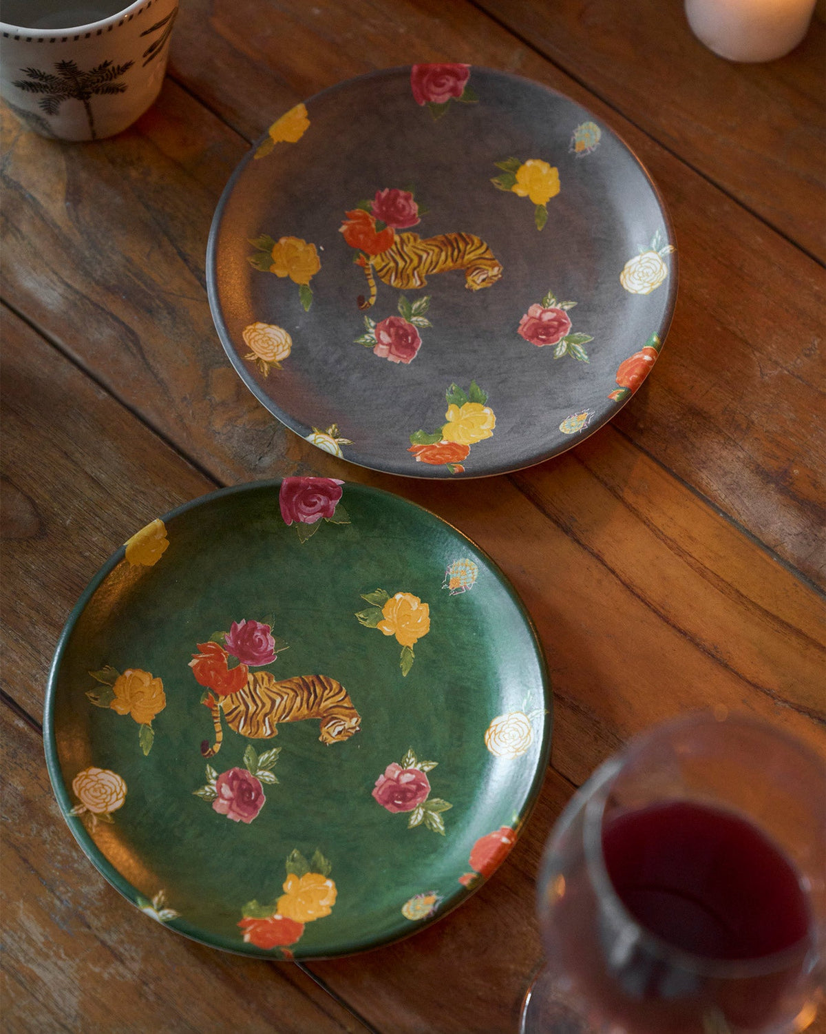 Close-up of two Wild Terrain Set plates with grey and green tiger motifs.
