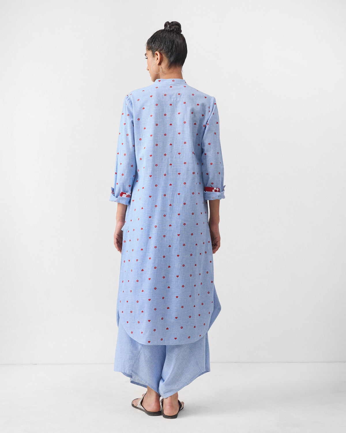 Back of a light blue Sakura set kurta with red heart motifs.