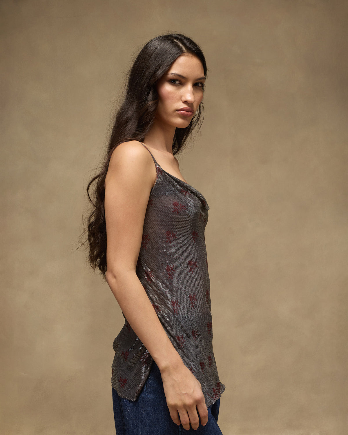 Side view of a charcoal sequined Flit top with spaghetti straps.