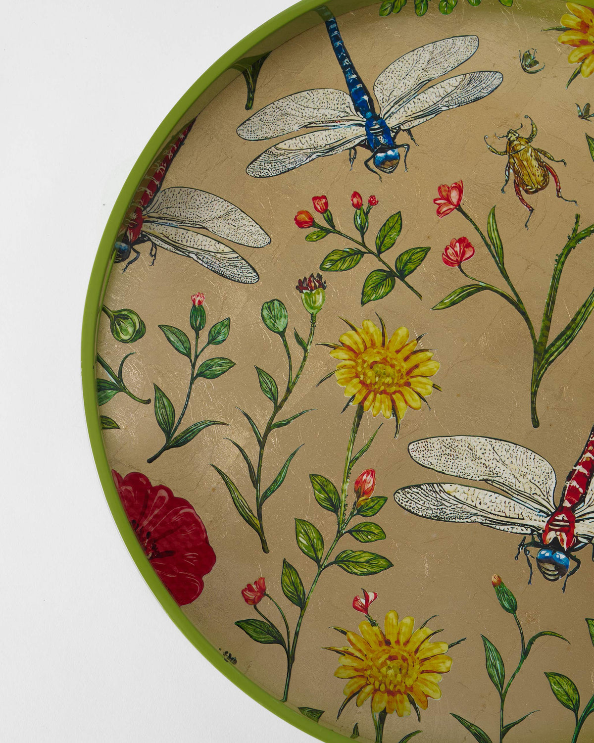Close-up of dragonfly and wildflower motifs on the Bloom round tray.