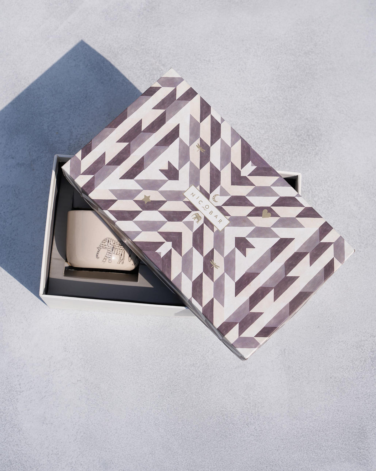 Open Nicobar gift box showing a cream Coastal Mug with an elephant.