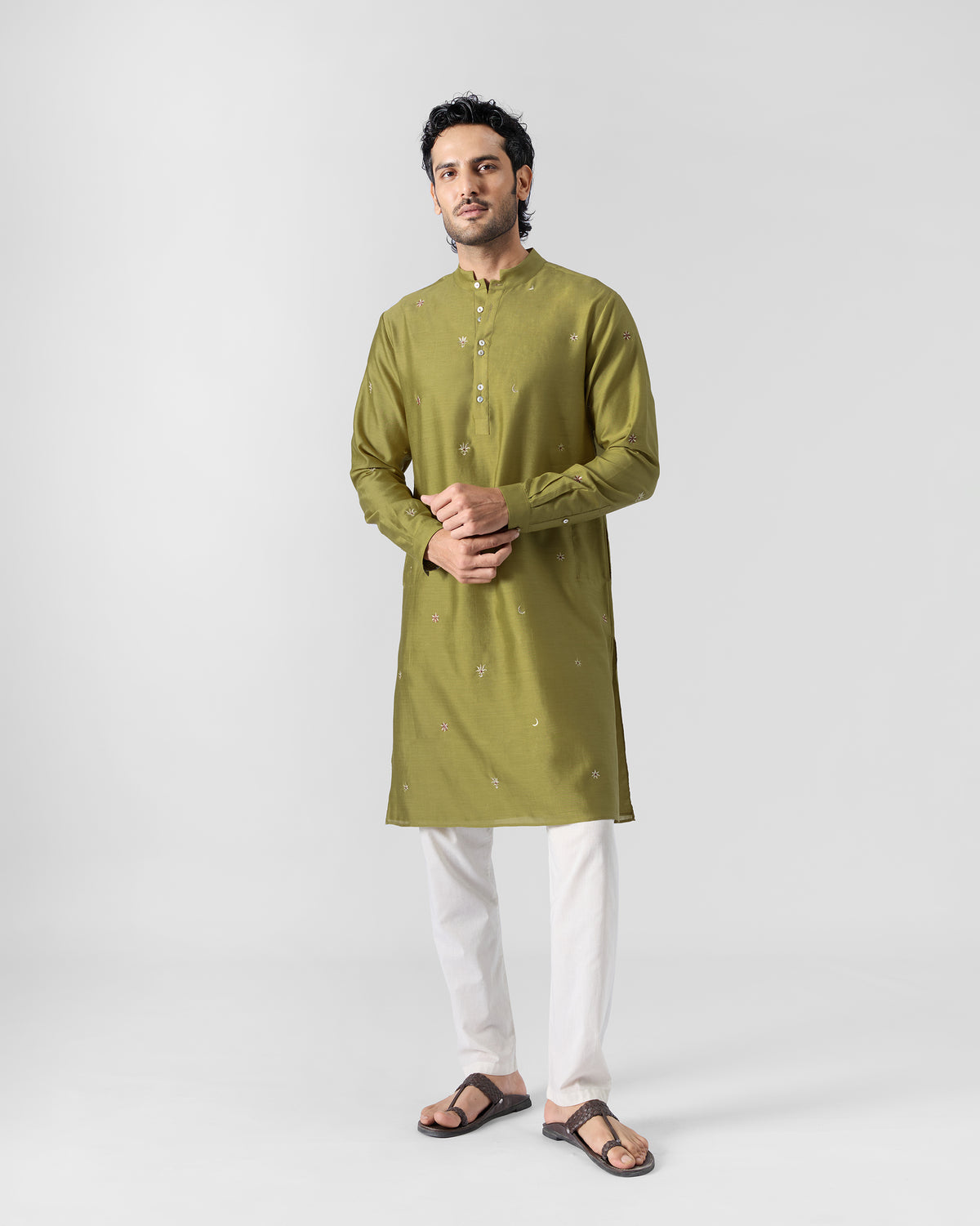 Front view of a person wearing an olive Rey kurta with a band collar.