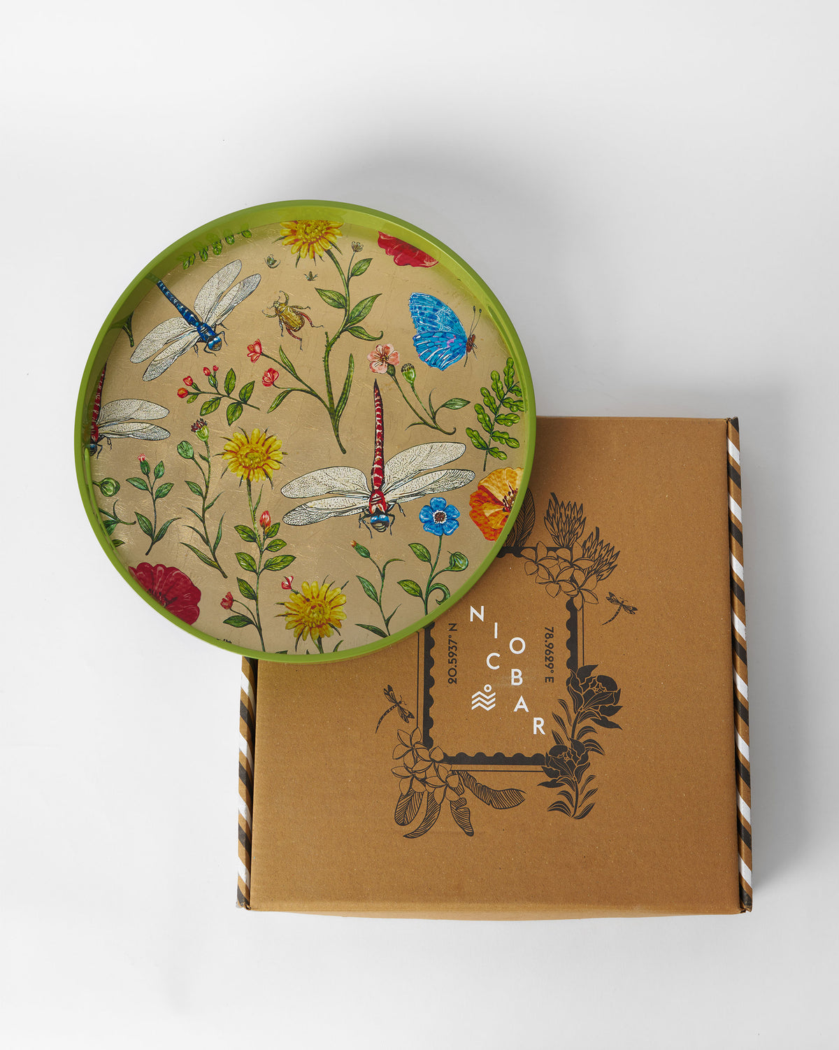 Bloom round tray resting on its kraft Nicobar gift box.