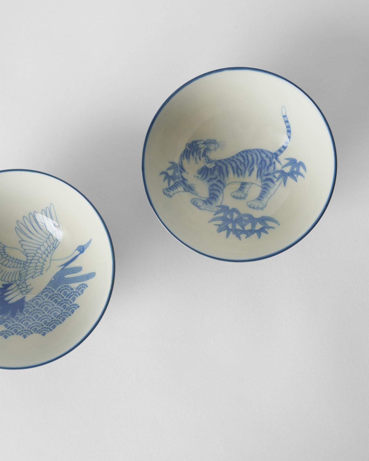 Blue Crane and Tiger Bowl interiors with a tiger in bamboo and a crane.