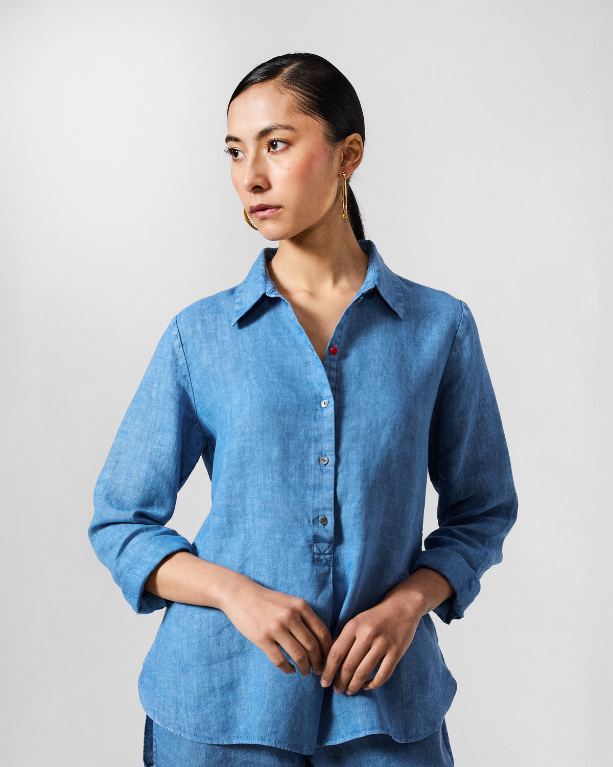 Person wearing a blue Mati shirt.