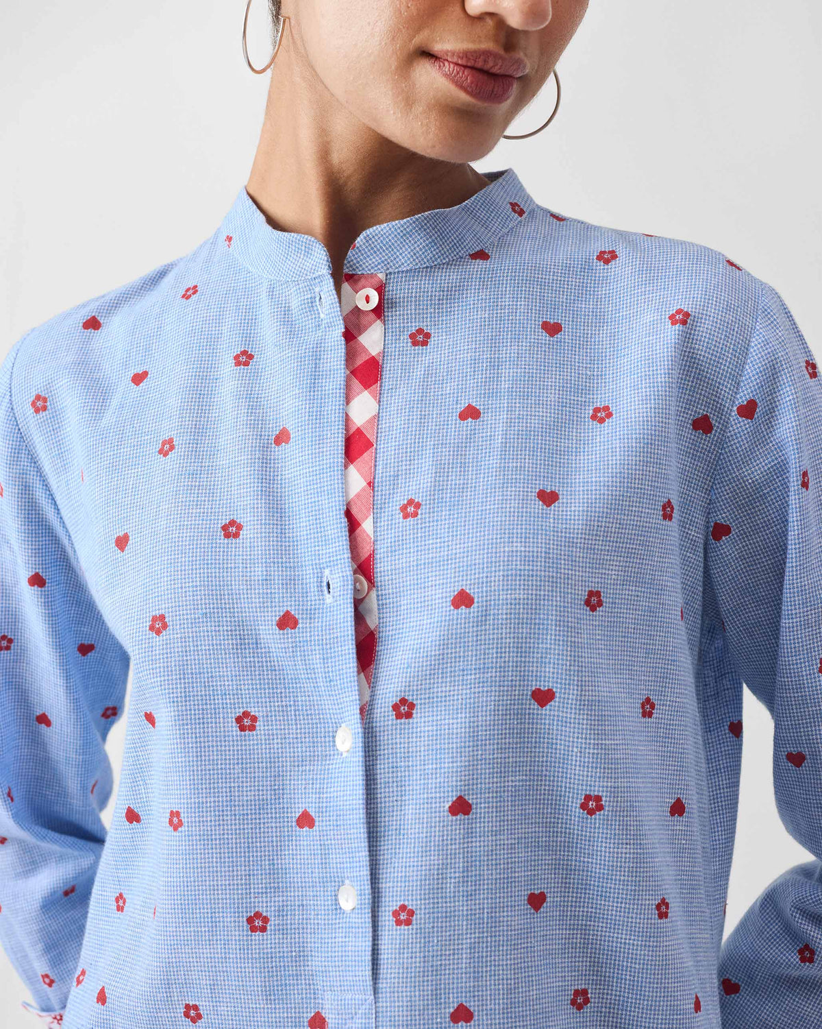 Close-up of a Sakura set kurta collar with a gingham placket lining.