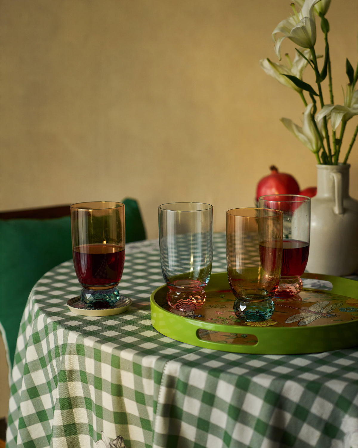 Reva sharbat glasses with jewelled bases filled for serving.