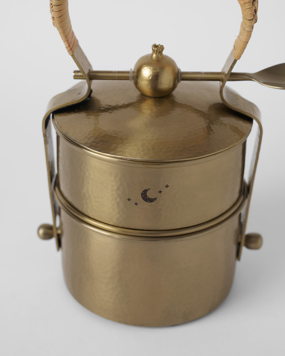 Gold Chand tiffin box with a rattan handle and locking spoon.