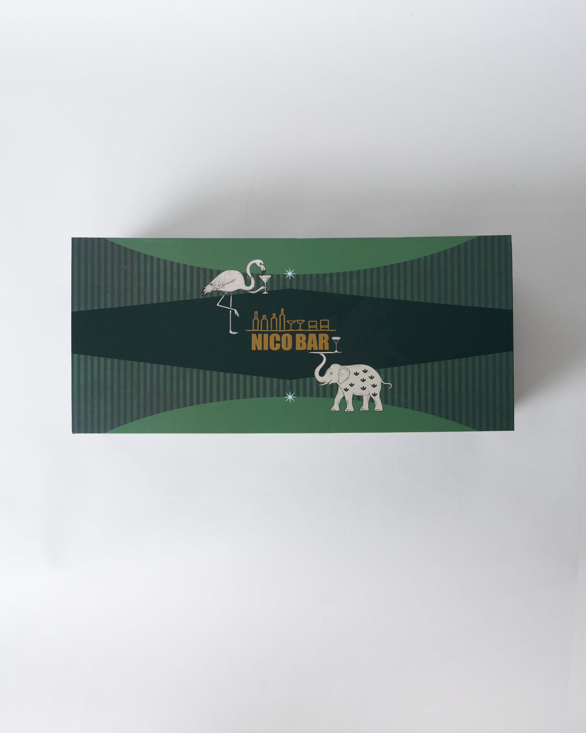 Nico Bar gift box lid with flamingo and elephant illustrations.