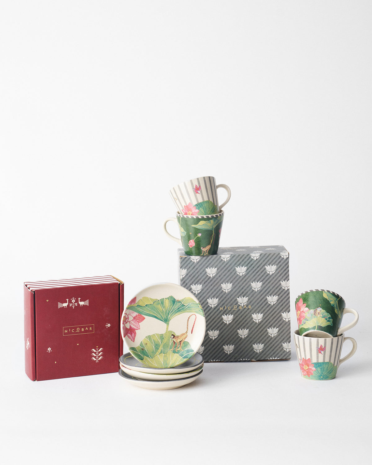 Floating Lotus set beside its red and grey gift boxes.