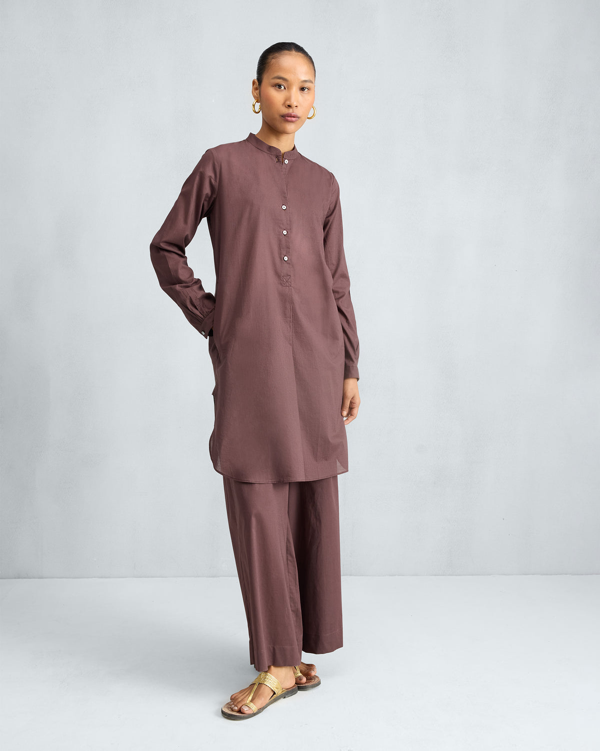 Chocolate plum mid-length kurta set with a mandarin collar and matching trousers.