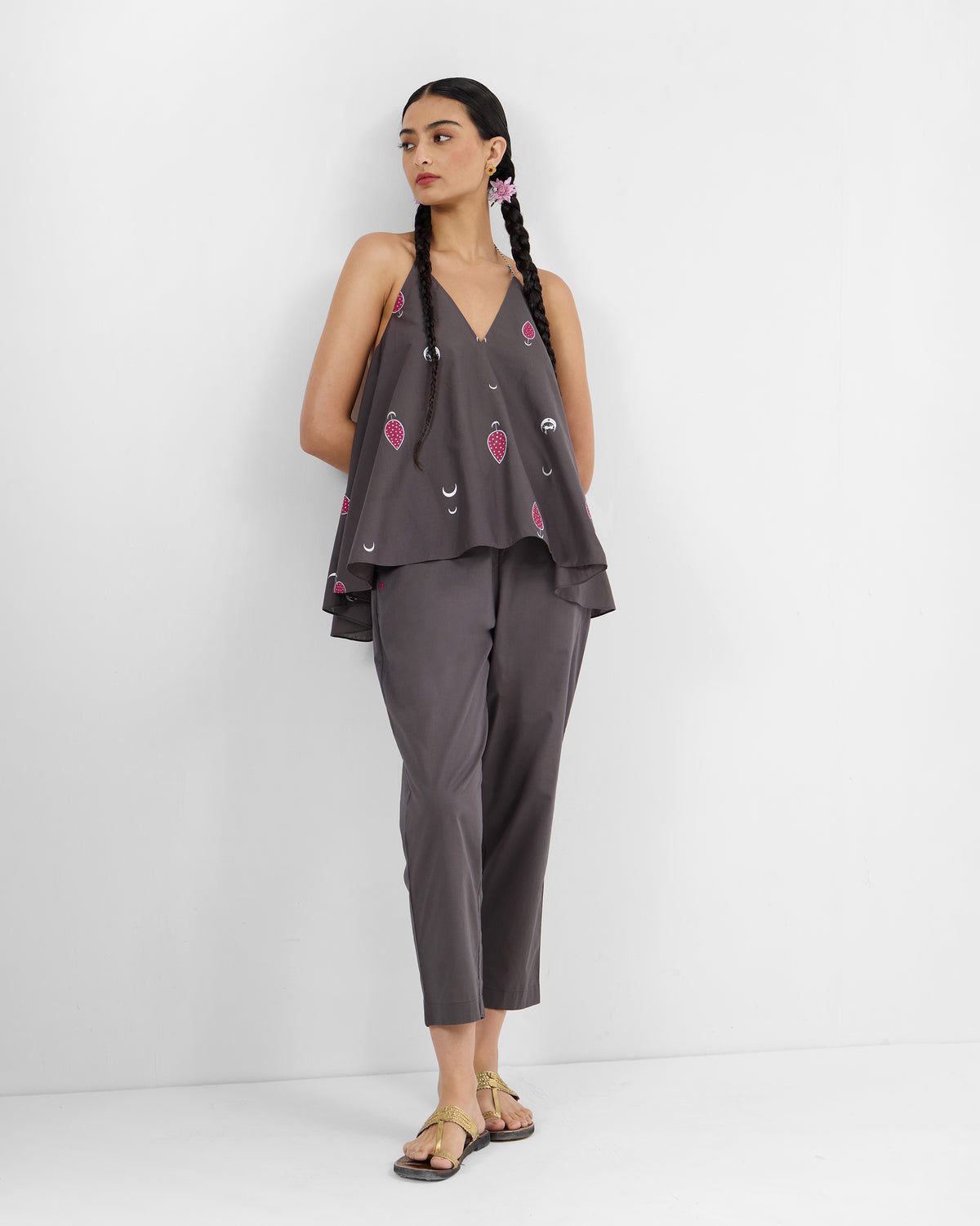 Person wearing a charcoal Daman top set with matching trousers.