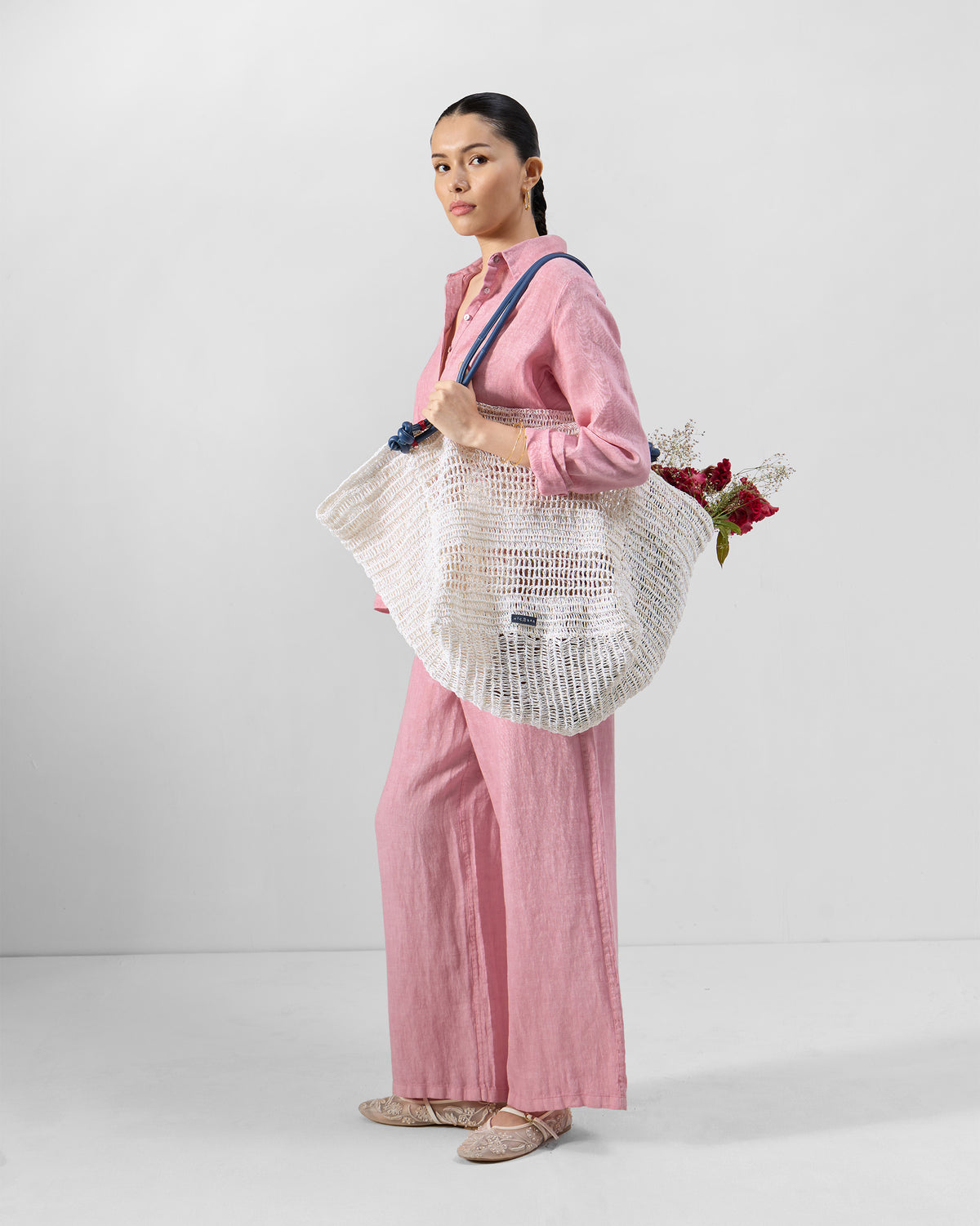 Person wearing a dusty pink Mati shirt set.
