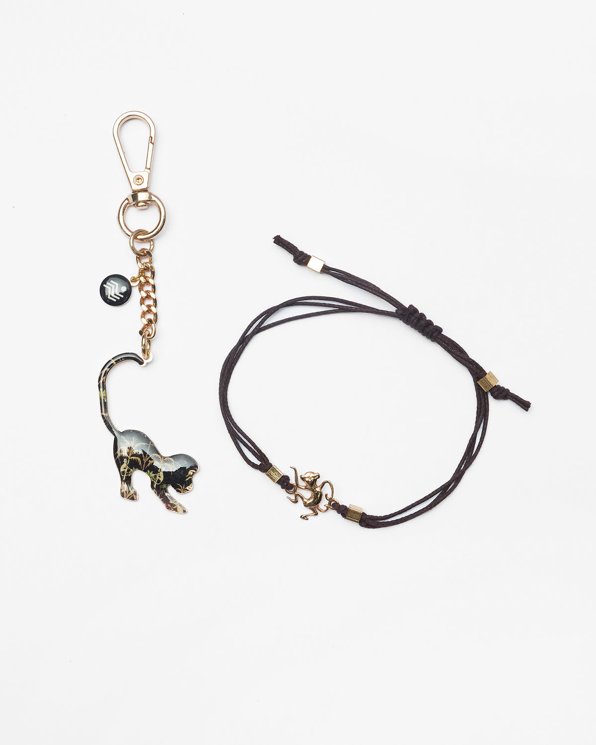 Monkey Rakhi set with a patterned monkey keychain and a cord bracelet charm.