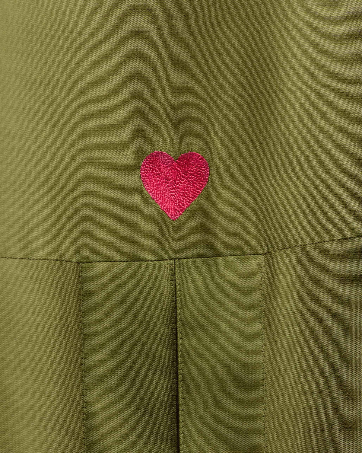 Close-up of the Cirrus Shirt Set with a red heart embroidery.