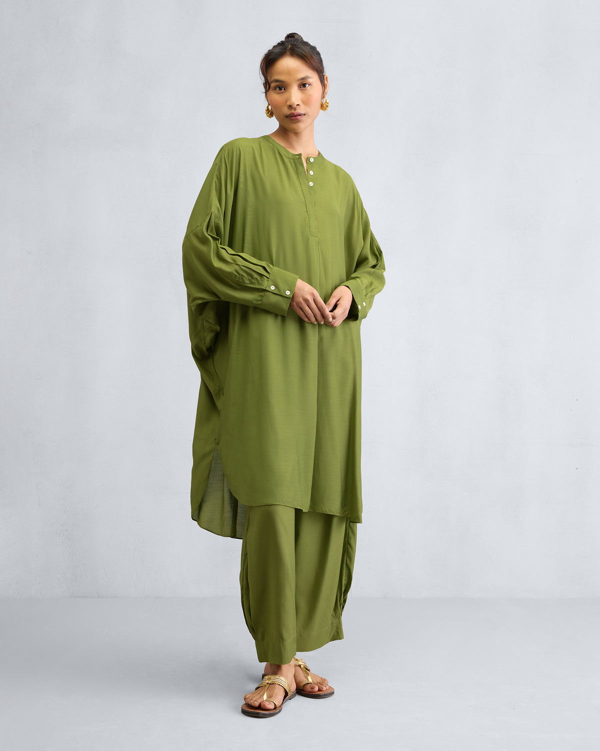 Person in the Lazy Sunday Tunic Set with a button placket at the neck.