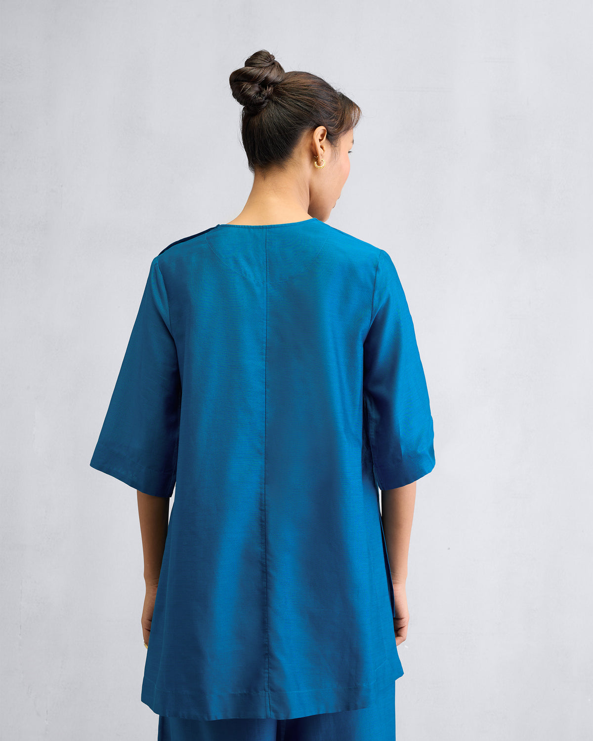 Back of the High Slit Top Set worn by a person.