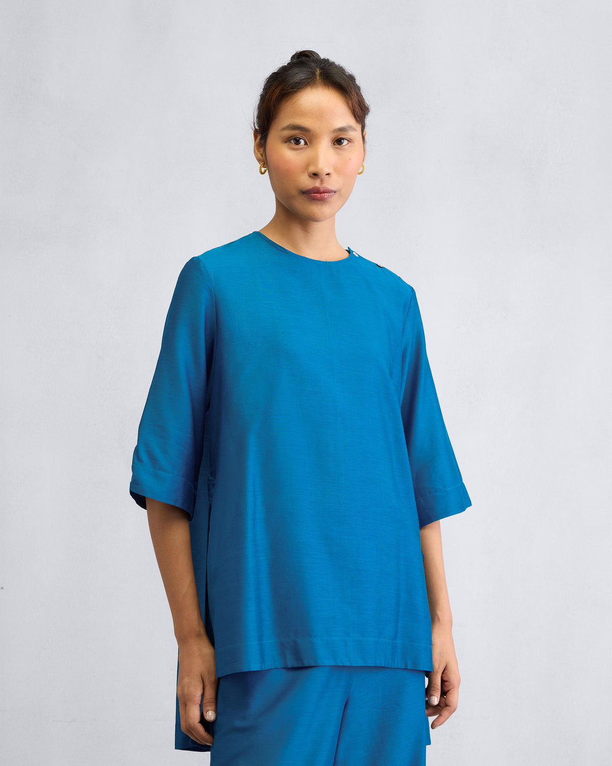 Person wearing the High Slit Top Set with three-quarter sleeves.