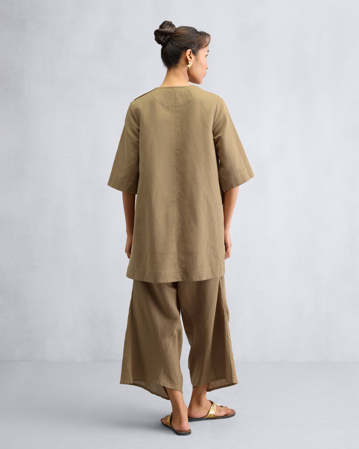 Back of the High Slit Top Set in taupe worn by a person.
