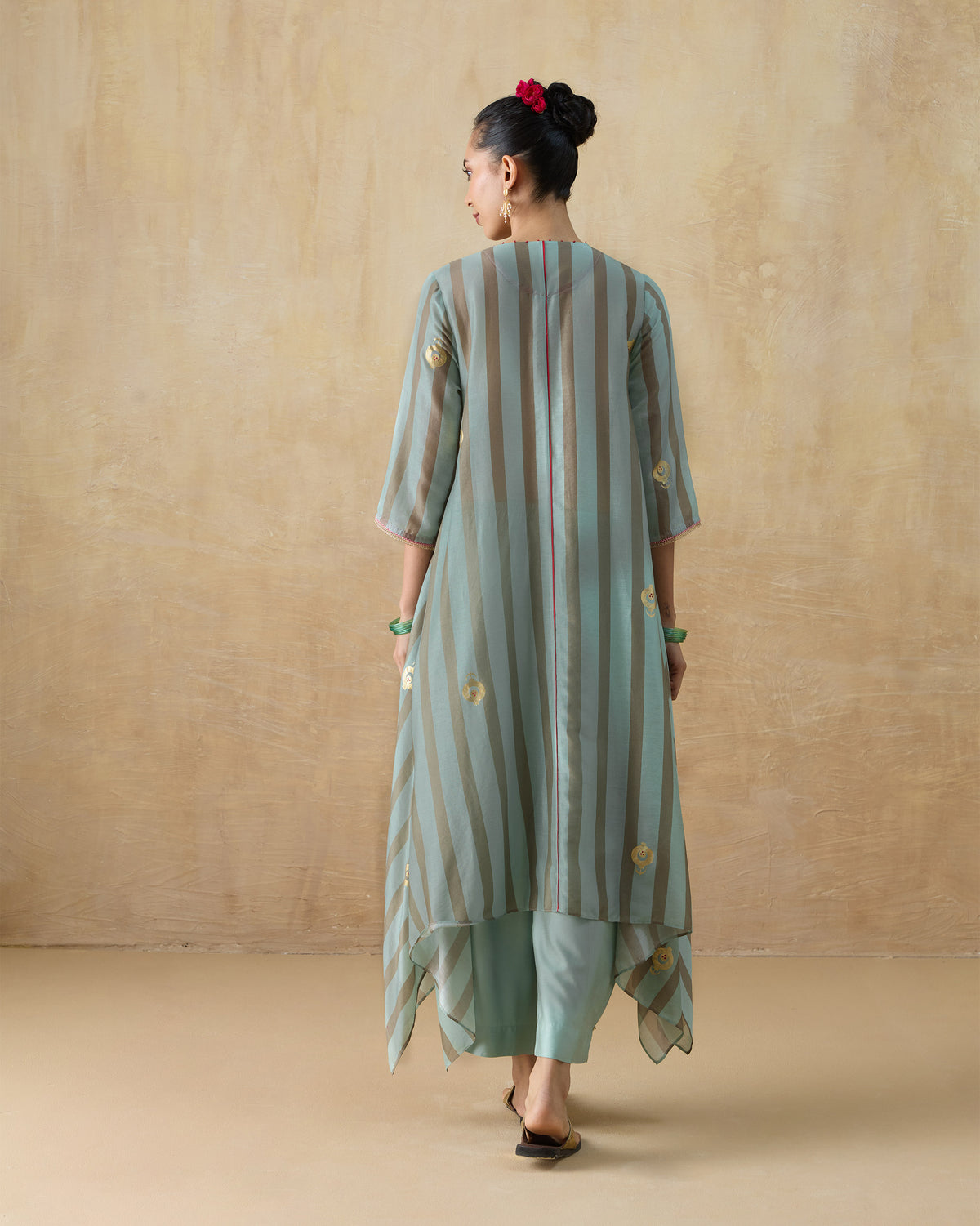 Back of a green and tan striped Midnight Club kurta with a maroon centre seam.
