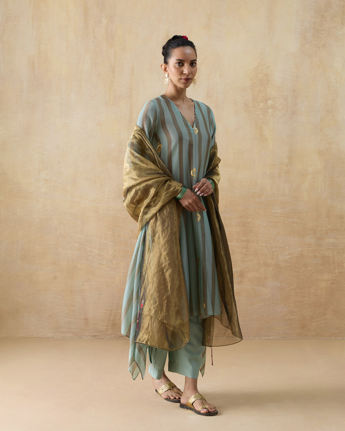 Midnight Club Kurta Set worn with a shimmering bronze dupatta over the shoulders.