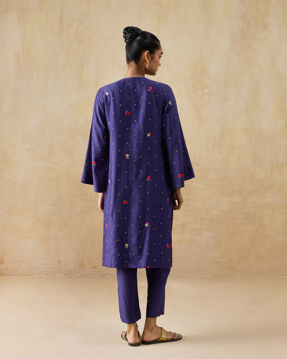 Back of a purple Nebula Kurta Set with scattered floral embroidery.