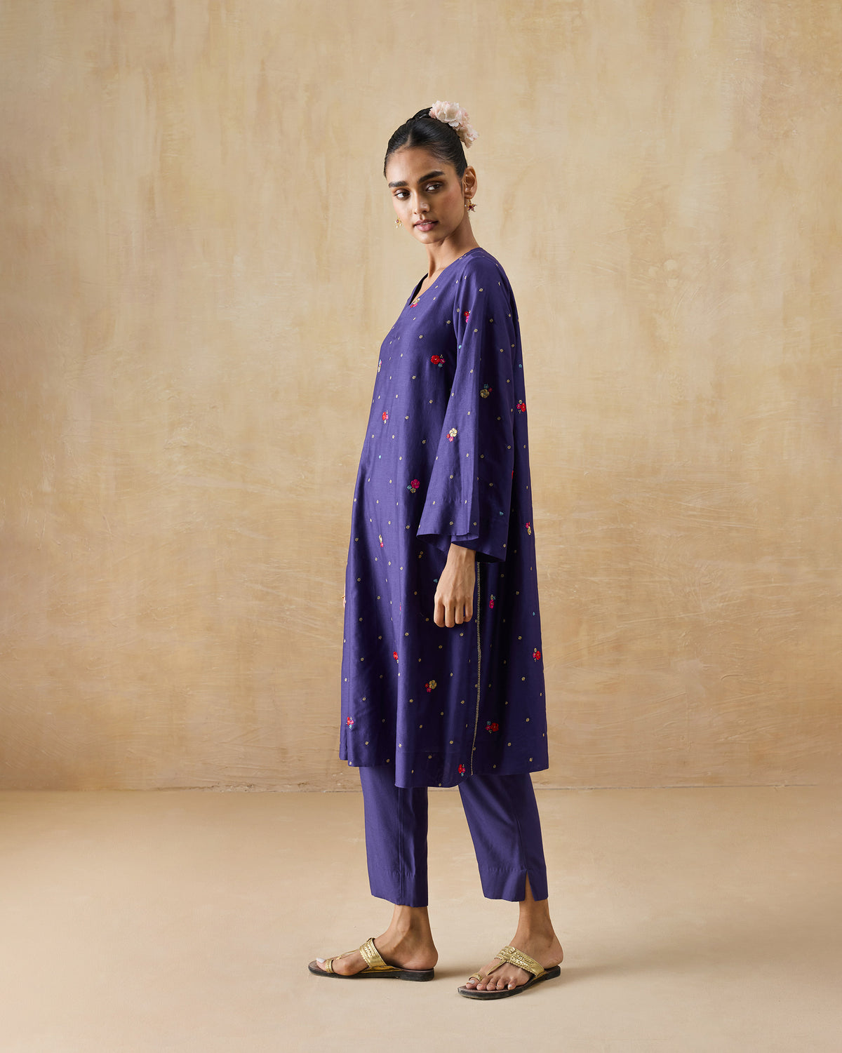 Person wearing a purple Nebula Kurta Set with flared sleeves.